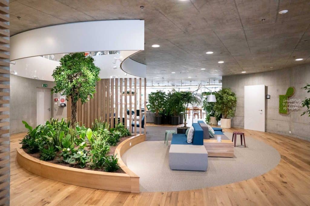 A break out space in an office with plant used for interior design